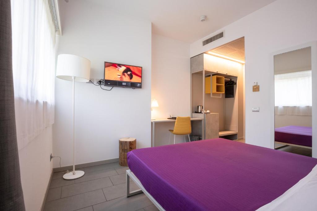 Łóżko lub łóżka w pokoju w obiekcie Hotel Stadio & Spa