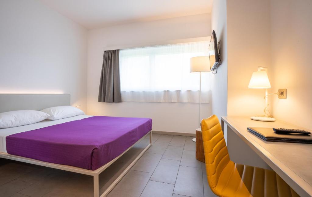Łóżko lub łóżka w pokoju w obiekcie Hotel Stadio & Spa