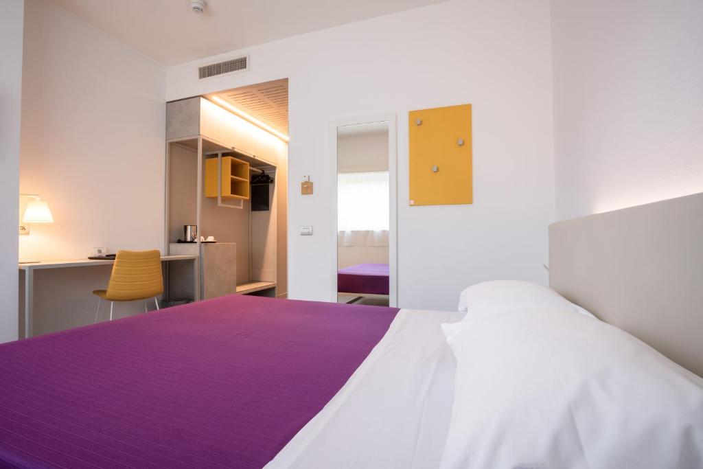 Łóżko lub łóżka w pokoju w obiekcie Hotel Stadio & Spa