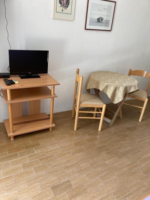 TV a/nebo společenská místnost v ubytování Studios Annie