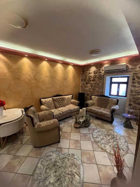a living room with two couches and a table at Apartment Kotor Old Town in Kotor