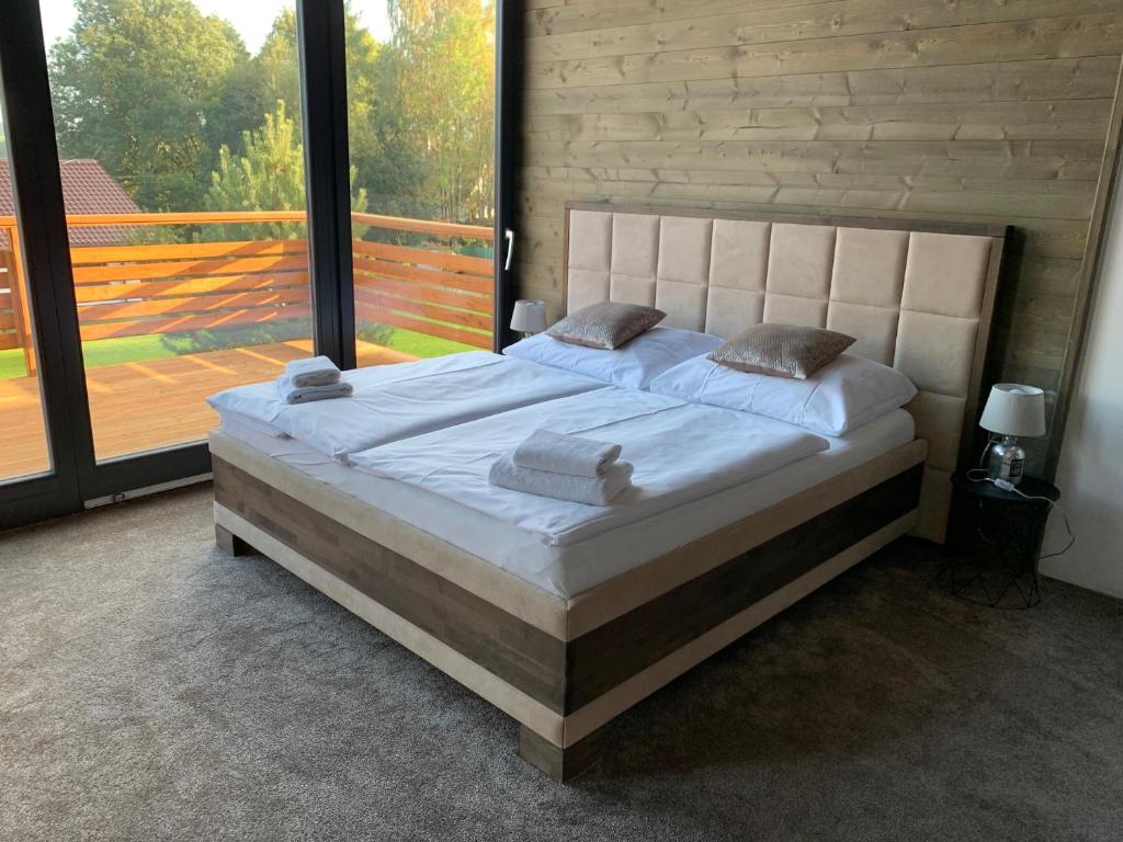 Postel nebo postele na pokoji v ubytování Wellness penzion Marta