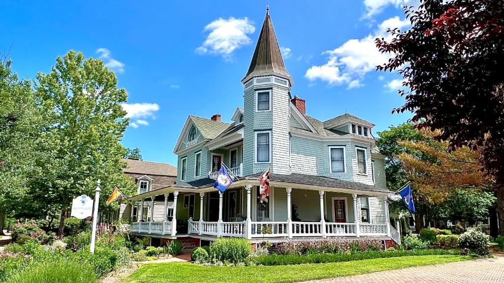 a large house with a steeple on top of it at Hummingbird Inn in Easton