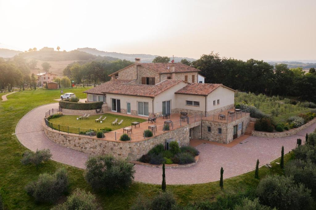 an aerial view of a large house in a field at Hortus Natural Living in Todi