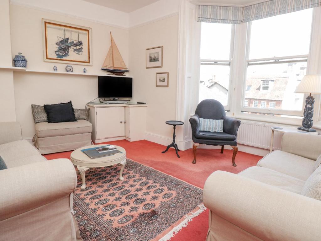 a living room with two couches and a tv at 29b Lower Street in Dartmouth