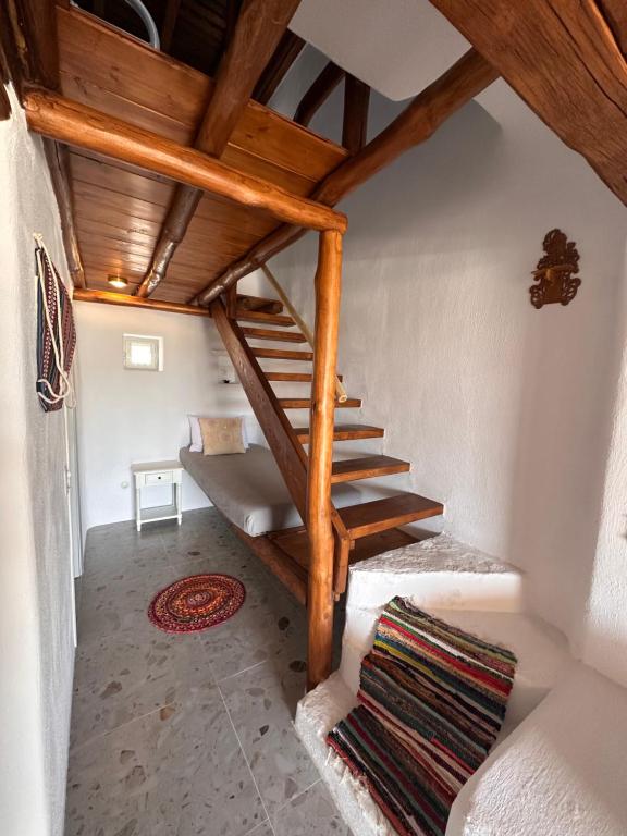 Postel nebo postele na pokoji v ubytování Rizes Mykonos - Folklore Farmstead