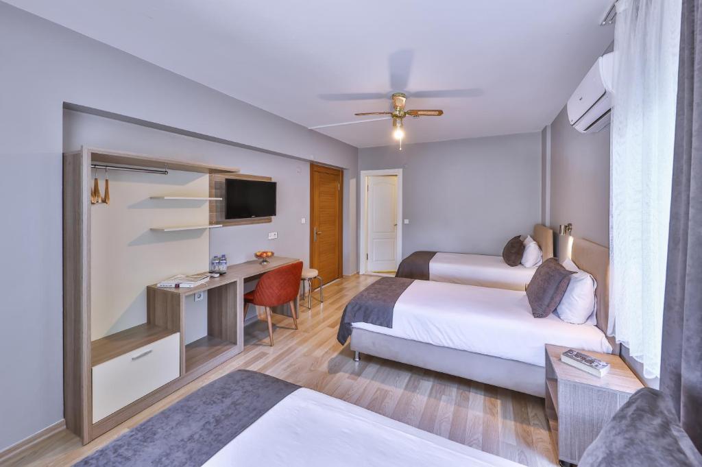 Postel nebo postele na pokoji v ubytování Palmada Hotel