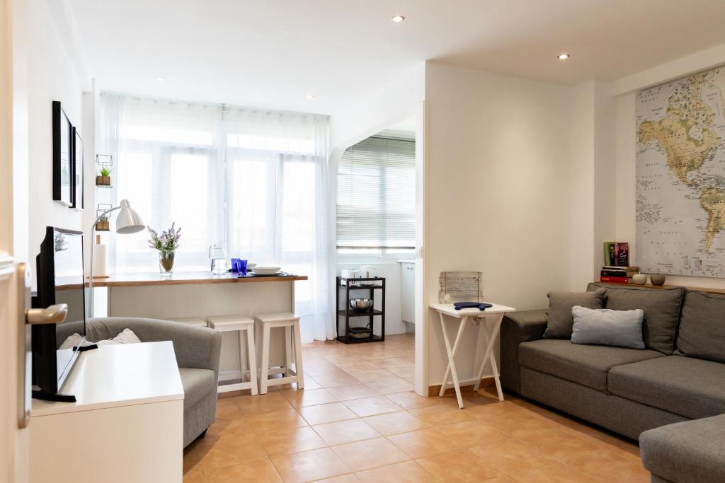 a living room with a couch and a table at Solar Home in Suances