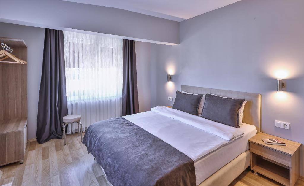 Postel nebo postele na pokoji v ubytování Palmada Hotel