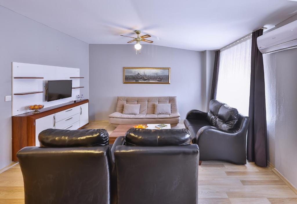 TV a/nebo společenská místnost v ubytování Palmada Hotel