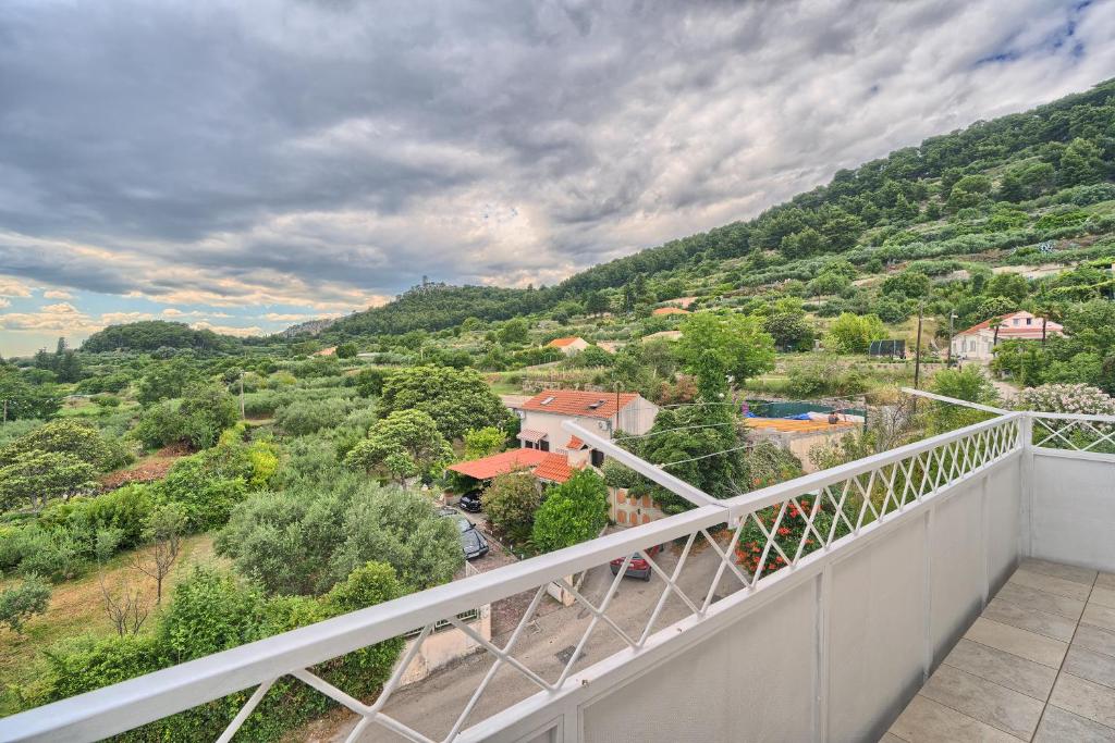 a balcony with a view of a mountain at A3 - luxury apt w big balcony 4 min walk to beach in Split