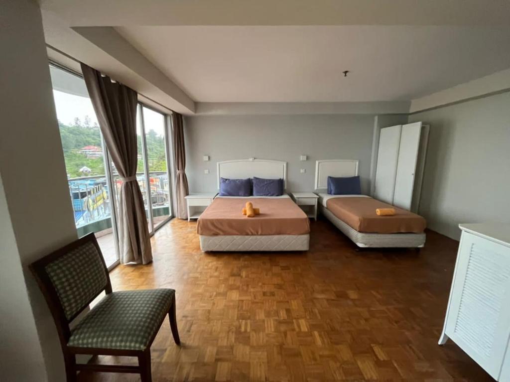 Postel nebo postele na pokoji v ubytování The Little Star Studio Hotel- Star Regency