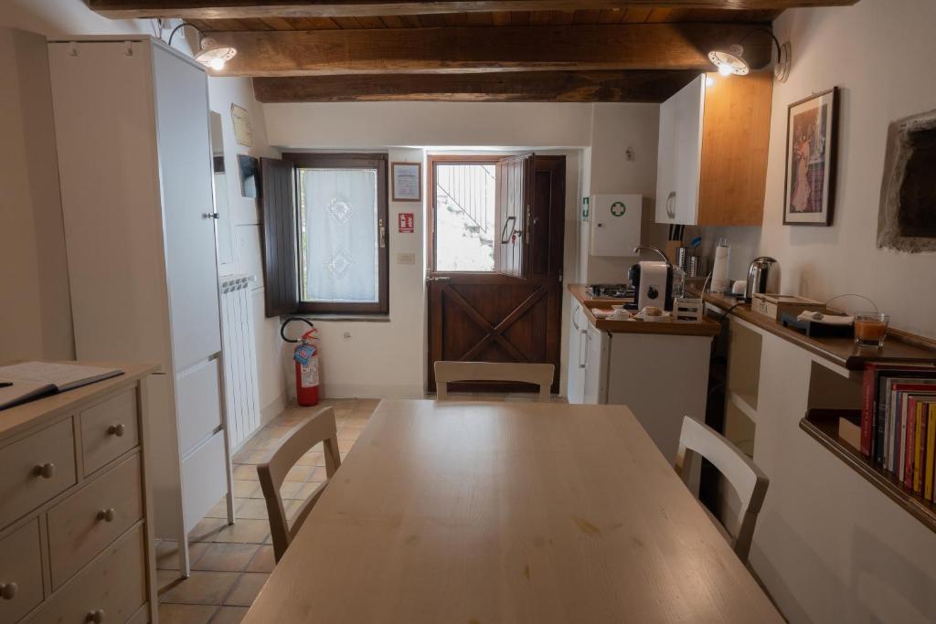 Kuchyň nebo kuchyňský kout v ubytování B&B Dimora Cigno