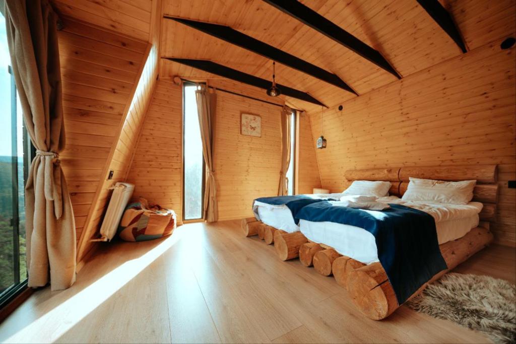 Postel nebo postele na pokoji v ubytování Cottage Galileo in Abastumani