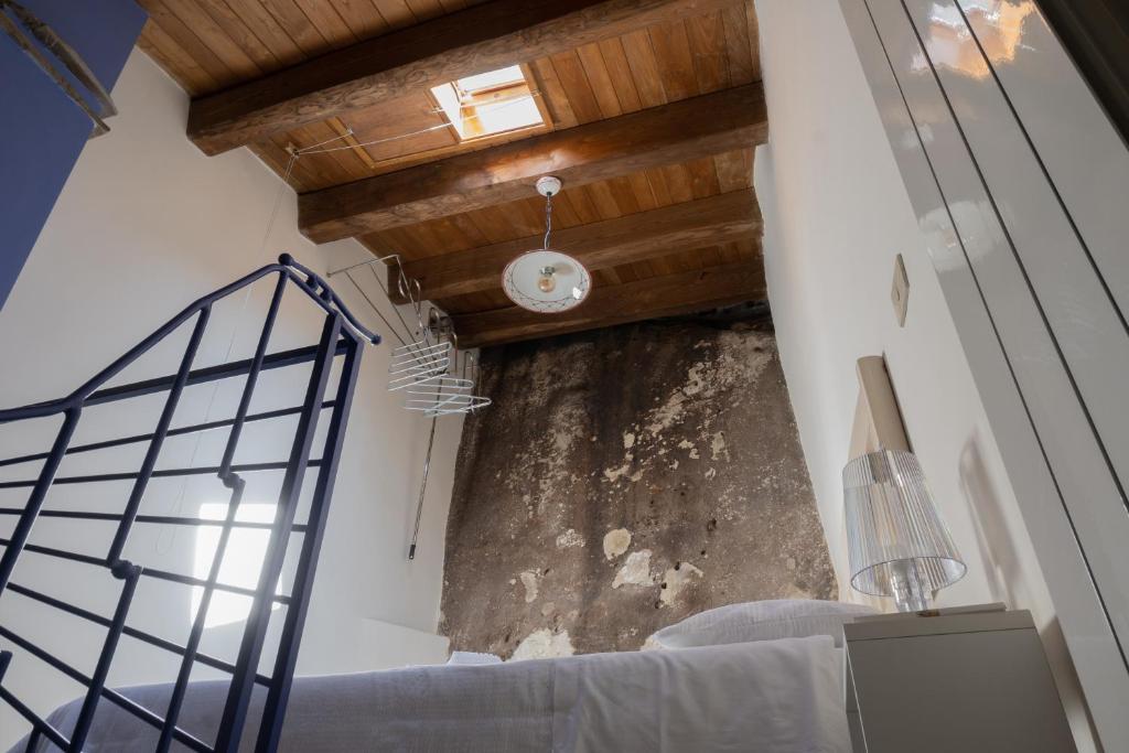 Postel nebo postele na pokoji v ubytování B&B Dimora Cigno