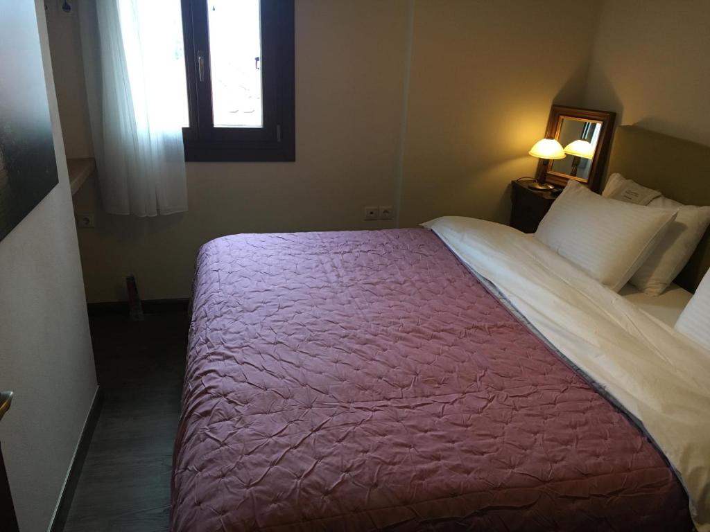 Postel nebo postele na pokoji v ubytování Aethri Pelion Suites