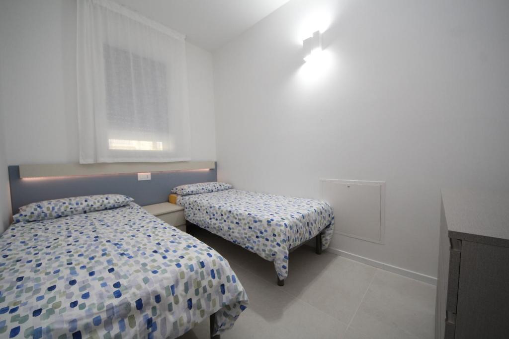Postel nebo postele na pokoji v ubytování Ca' Del Mare