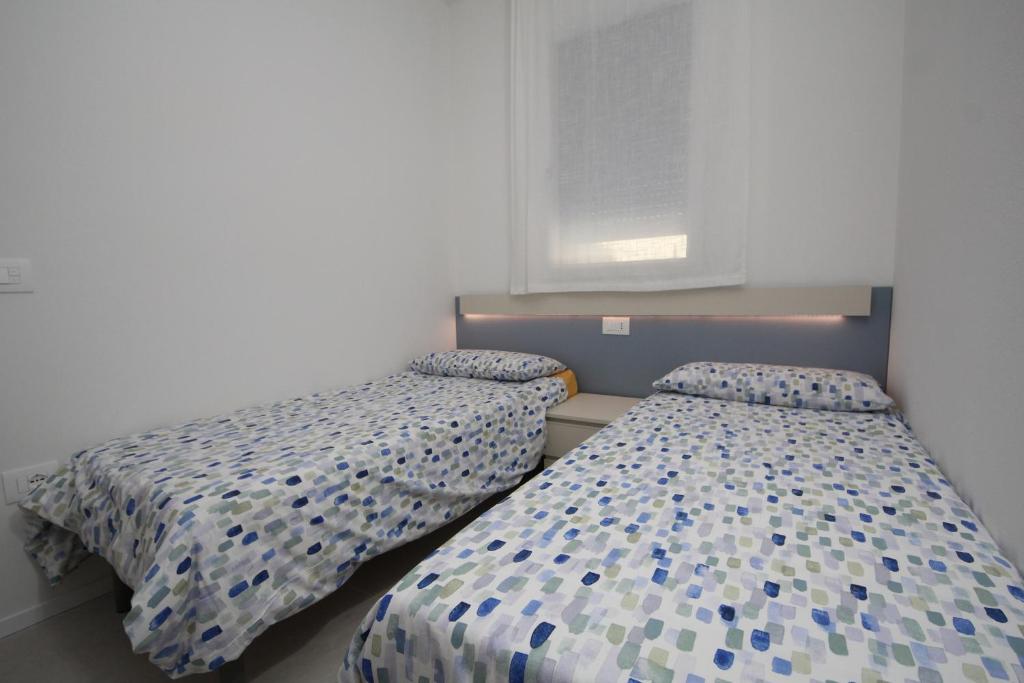 Postel nebo postele na pokoji v ubytování Ca' Del Mare
