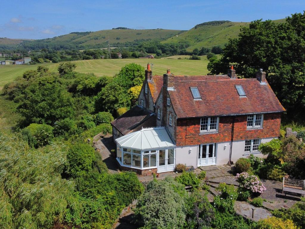 an aerial view of a house in the countryside at Paythorne Farmhouse in Henfield