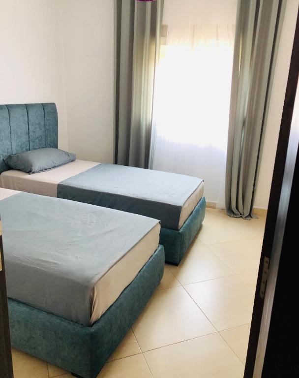 Postel nebo postele na pokoji v ubytování Appartement Charmant