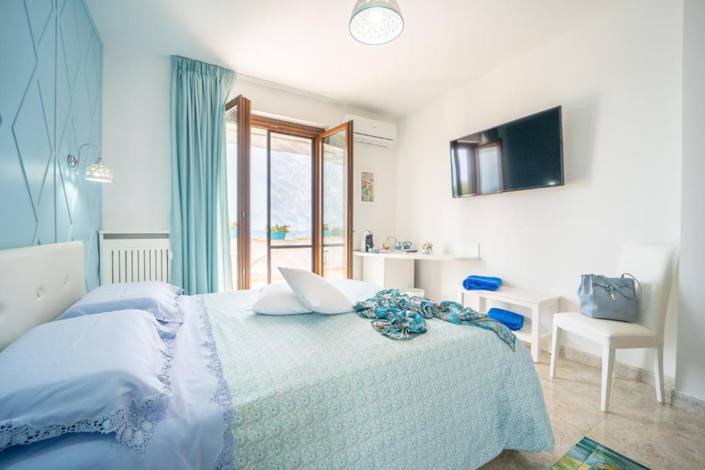 Postel nebo postele na pokoji v ubytování Almaré B&B