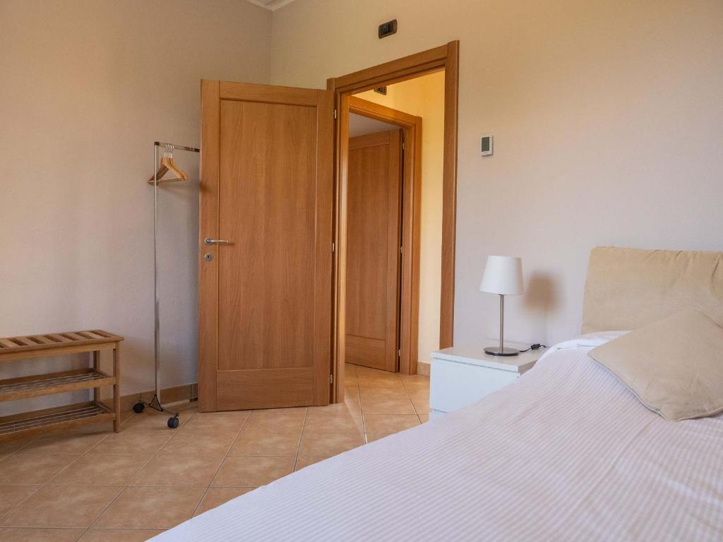 Łóżko lub łóżka w pokoju w obiekcie Villa Olivee