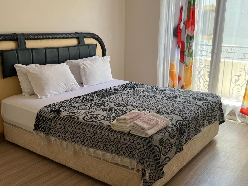 Postel nebo postele na pokoji v ubytování Grand Teoshan Otel ve Tatil Evleri