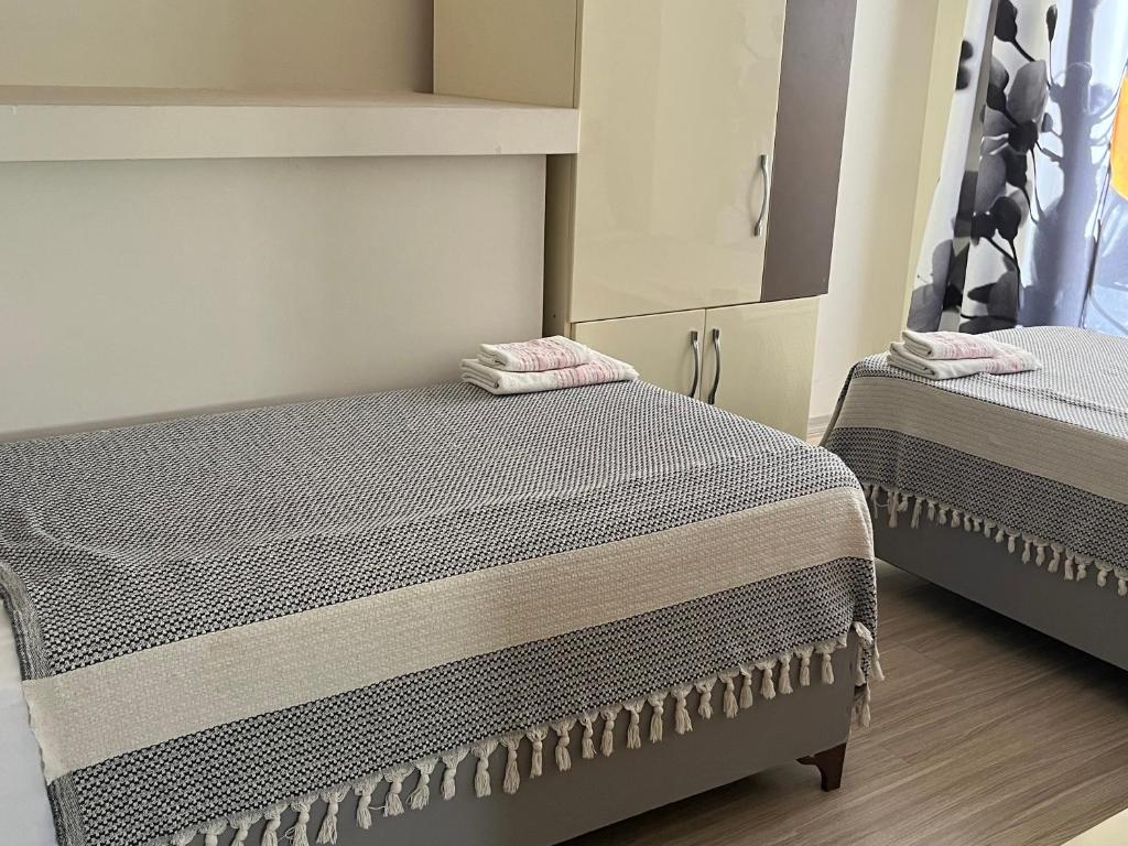 Postel nebo postele na pokoji v ubytování Grand Teoshan Otel ve Tatil Evleri
