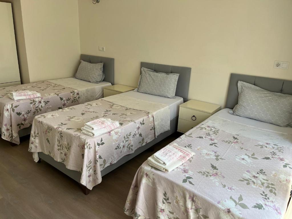 Postel nebo postele na pokoji v ubytování Grand Teoshan Otel ve Tatil Evleri