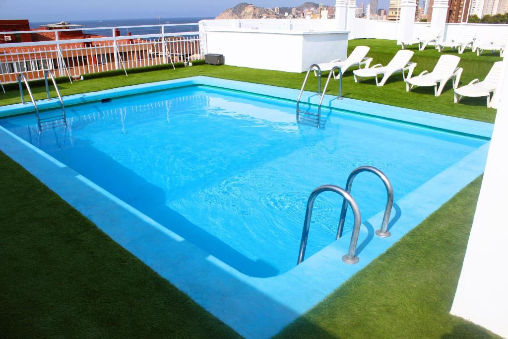 a swimming pool on the roof of a building at FLEMING PLAYA PONIENTE in Benidorm