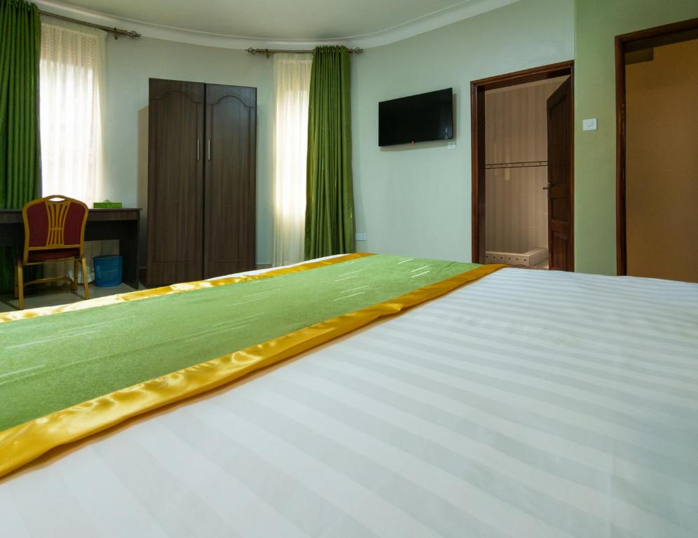 Postel nebo postele na pokoji v ubytování Excelsis Garden Hotels - Kampala