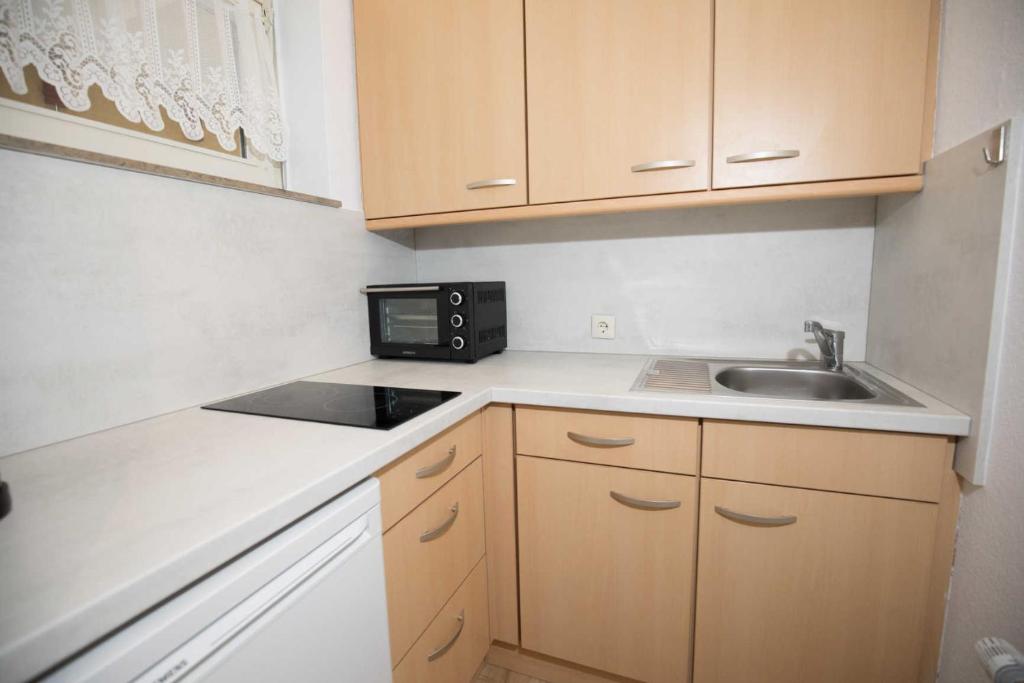 Kuchyň nebo kuchyňský kout v ubytování Terrassenhaus, FeWo 58