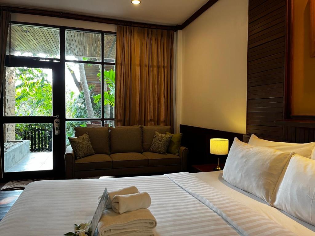 Ein Bett oder Betten in einem Zimmer der Unterkunft Green Papaya Beach Resort, Koh Phangan