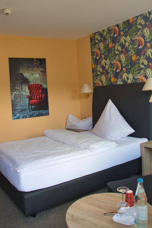 Postel nebo postele na pokoji v ubytování Hotel Quellenhof