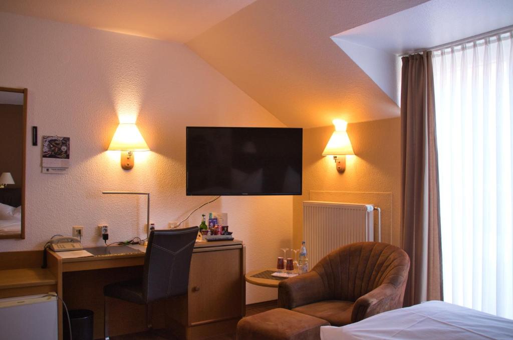 TV a/nebo společenská místnost v ubytování Hotel Quellenhof