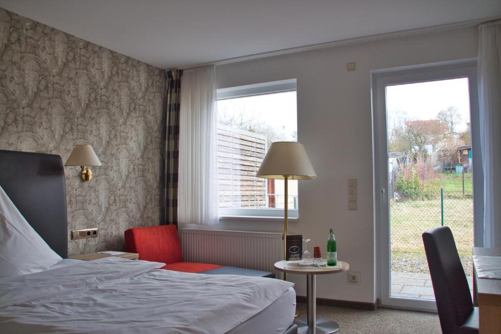 Postel nebo postele na pokoji v ubytování Hotel Quellenhof