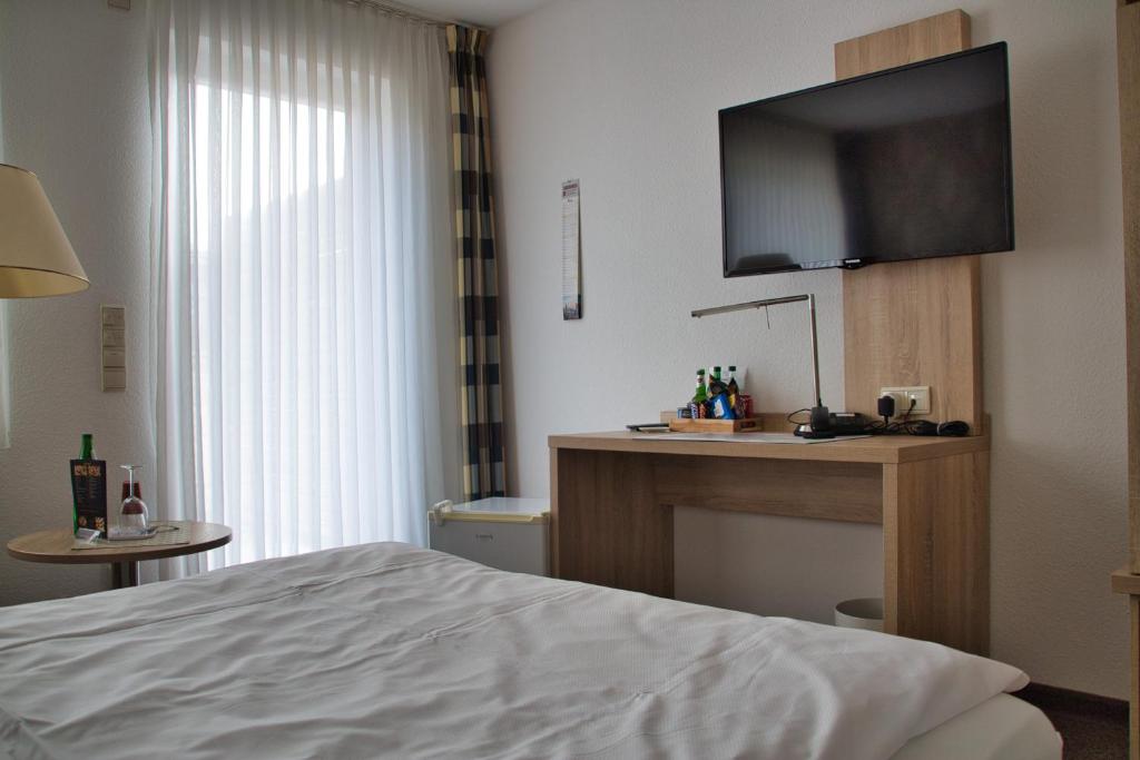 Postel nebo postele na pokoji v ubytování Hotel Quellenhof