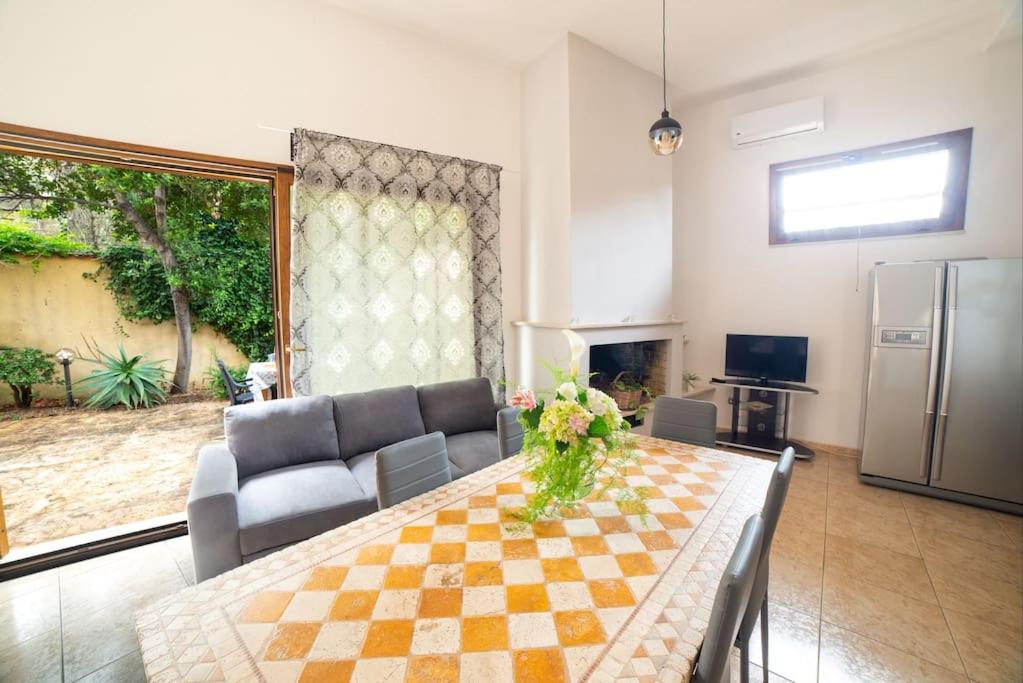 a living room with a table and a couch at Casa di Betty in Càbras