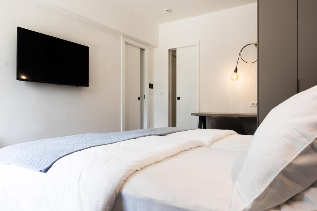 Posteľ alebo postele v izbe v ubytovaní Hotel Alkar