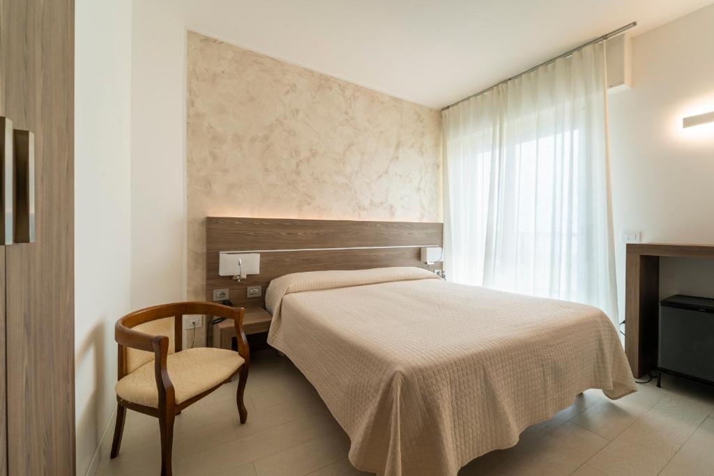 Postel nebo postele na pokoji v ubytování Hotel Capri 3 Stelle SUPERIOR