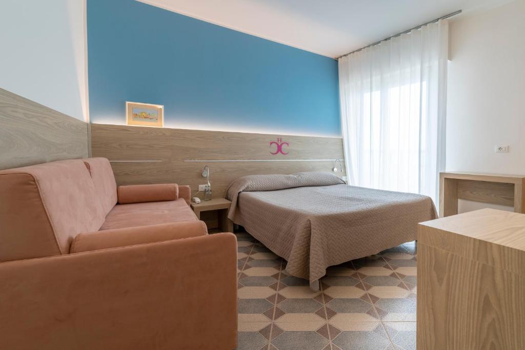 Postel nebo postele na pokoji v ubytování Hotel Capri 3 Stelle SUPERIOR