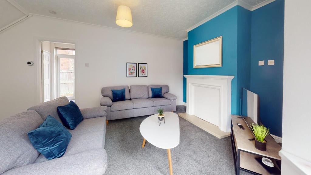 a living room with a couch and a table at Stratford House Hartlepool Horizon Stays in Hartlepool