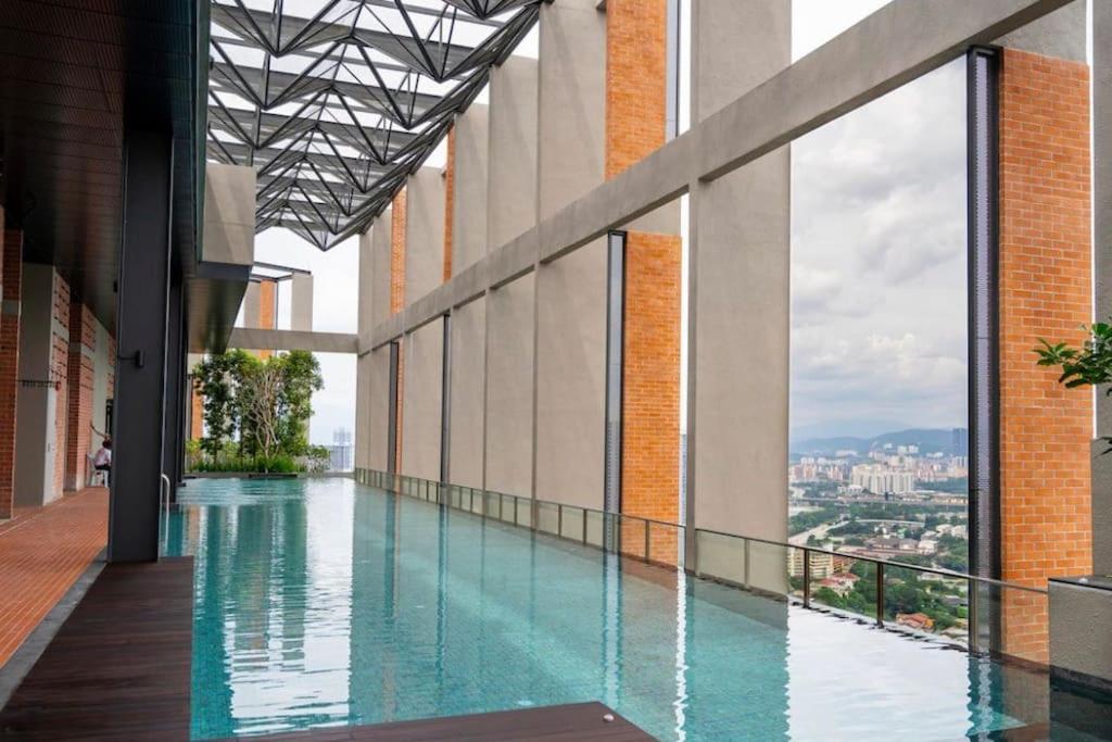a swimming pool on the side of a building at KL Luxury Family Suite 2Bedroom 2Bathroom in Kuala Lumpur