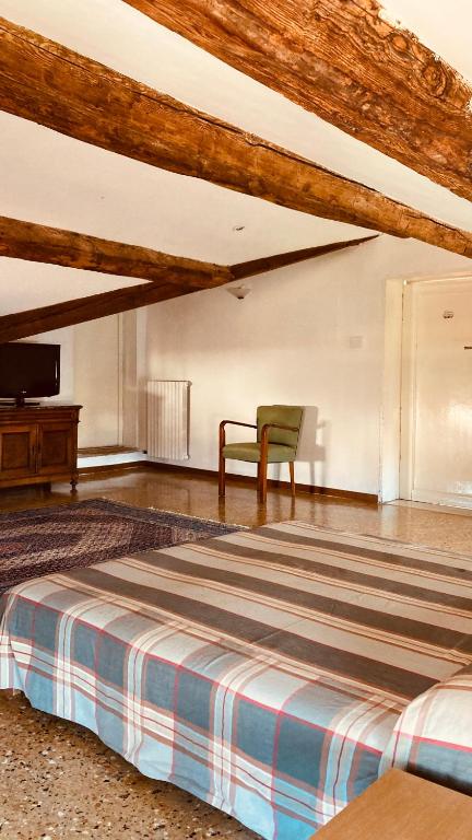 A bed or beds in a room at Cà Sardi