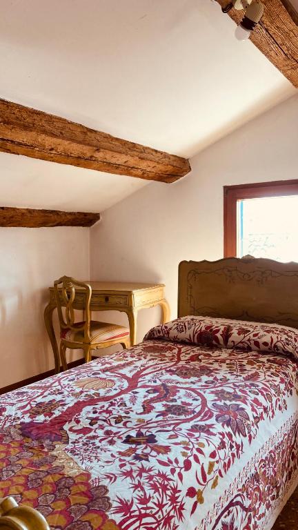 A bed or beds in a room at Cà Sardi