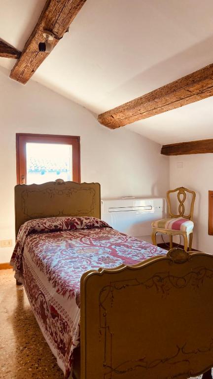 A bed or beds in a room at Cà Sardi
