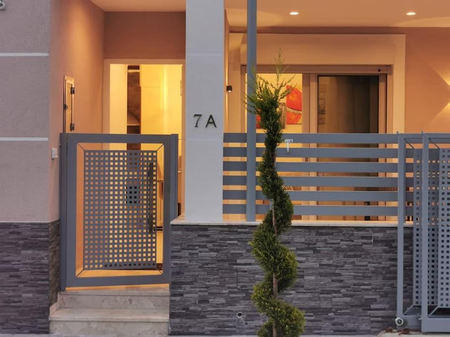 a front door of a house with a plant at Keti's home in Athens
