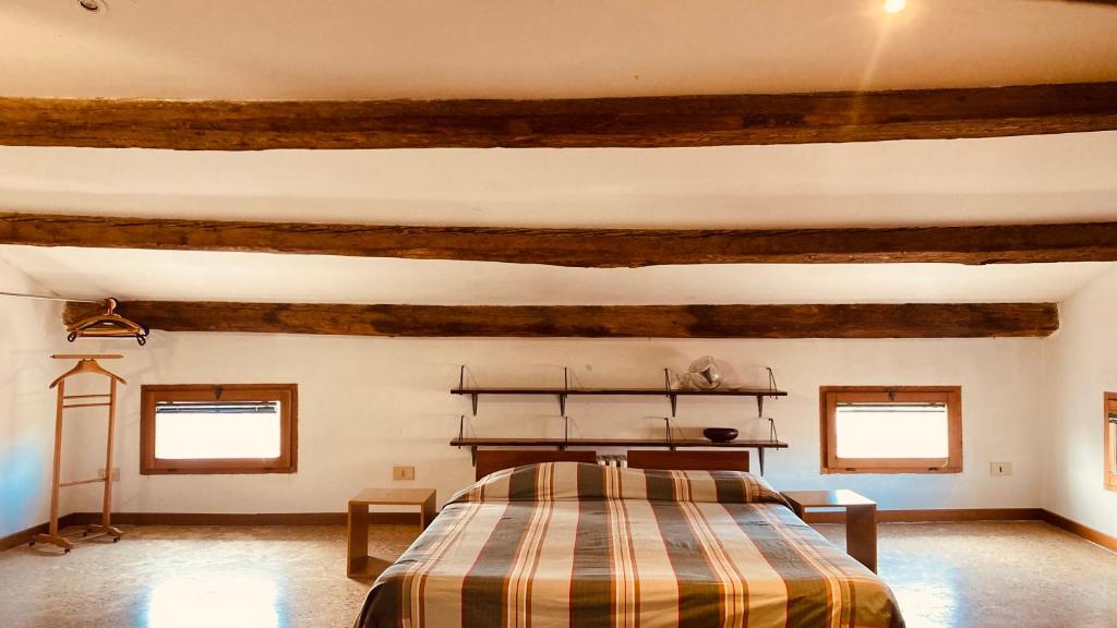 A bed or beds in a room at Cà Sardi