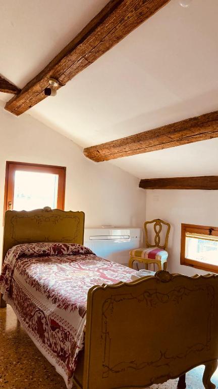 A bed or beds in a room at Cà Sardi