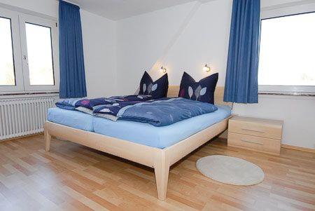 Postel nebo postele na pokoji v ubytování Haus Hafenblick